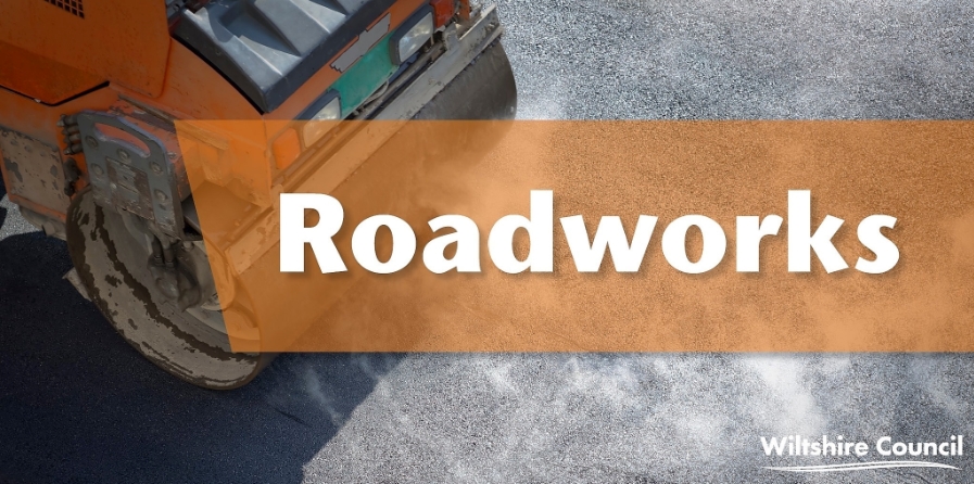 Image of word Roadworks superimposed over roadroller on road surface.
